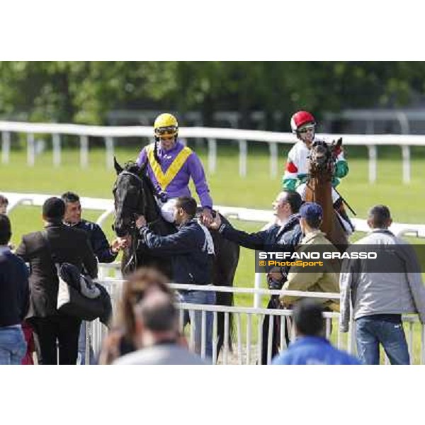 Fabio Branca returns home on Saratoga Black after winning the Premio Ambrosiano Milano - San Siro galopp racecourse, 22nd april 2012 ph.Stefano Grasso