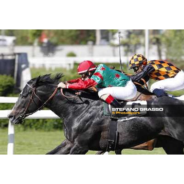 Mirco Demuro and Sopran Montieri go to win the Premio Rovato. Il Banchiere is second Milano - San Siro galopp racecourse, 22nd april 2012 photo Stefano Grasso