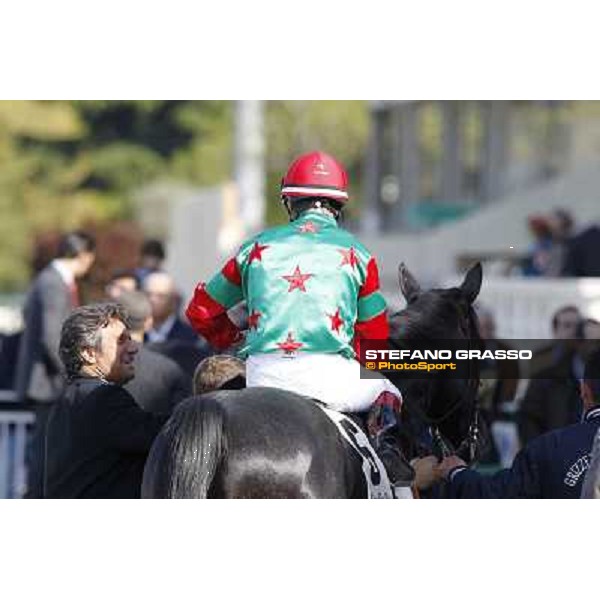 Bruno Grizzetti, Mirco Demuro and Sopran Montieri enter the winner circle after winning the Premio Rovato. Milano - San Siro galopp racecourse, 22nd april 2012 photo Stefano Grasso