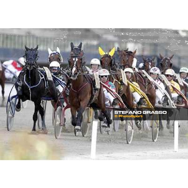 Pietro Gubellini with Owen Cr leads the group at the first turn of the Gran Premio d\'Europa Milan - San Siro trot racecourse, 25th april 2012 ph..Stefano Grasso