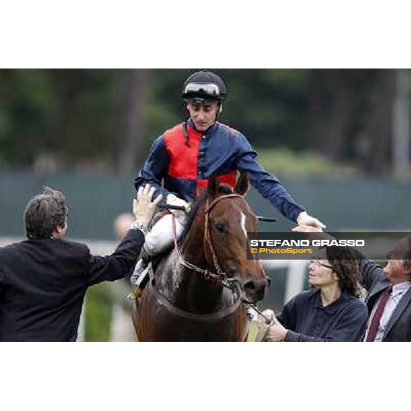 Matteo Limata and Riccardo Menichetti congratulate with Carlo Fiocchi returning home on United Color after winning the Premio Tudini. Roma - Capannelle racecourse, 20th may 2012 ph.Stefano Grasso