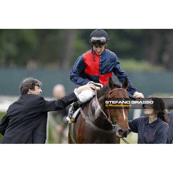 Matteo Limata congratulates with Carlo Fiocchi returning home on United Color after winning the Premio Tudini. Roma - Capannelle racecourse, 20th may 2012 ph.Stefano Grasso