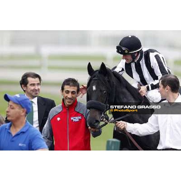 Mirco Demuro returns home on Nabucco after winning the Premio Vittorio Riva - close to him Peter Franceschini Milan, San Siro racecourse, 23rd sept.2012 ph.Stefano Grasso