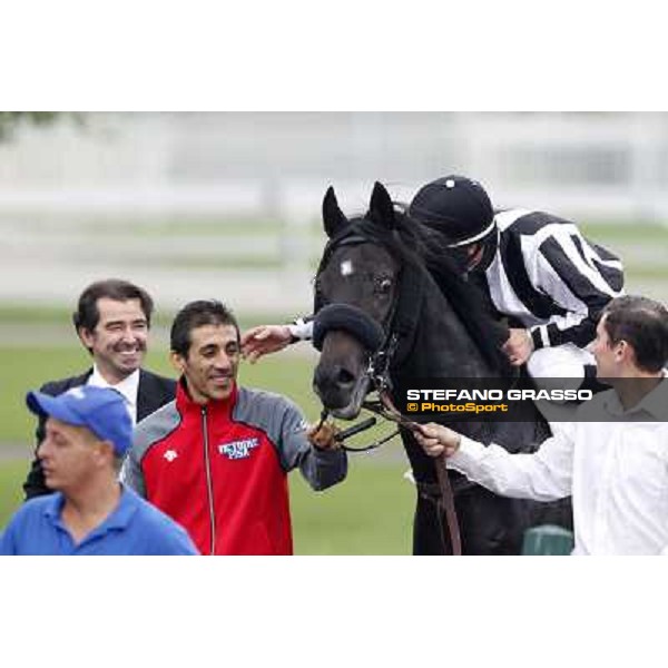 Mirco Demuro returns home on Nabucco after winning the Premio Vittorio Riva - close to him Peter Franceschini Milan, San Siro racecourse, 23rd sept.2012 ph.Stefano Grasso
