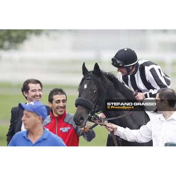 Mirco Demuro returns home on Nabucco after winning the Premio Vittorio Riva - close to him Peter Franceschini Milan, San Siro racecourse, 23rd sept.2012 ph.Stefano Grasso