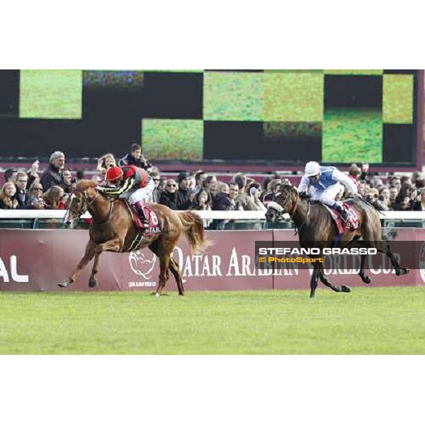 Olivier Peslier on Solemia wins the Qatar Prix de L\'Arc de Triomphe beating Christophe Soumillon on Orfevre Paris - Longchamp racecourse 7th oct..2012 ph.Stefano Grasso