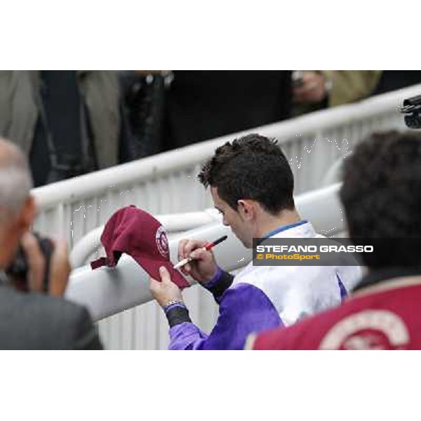 Paris - Longchamp racecourse Umberto Rispoli signs autographs after winning the Prix du Cadran Paris, 7th oct.2012 ph.Stefano Grasso