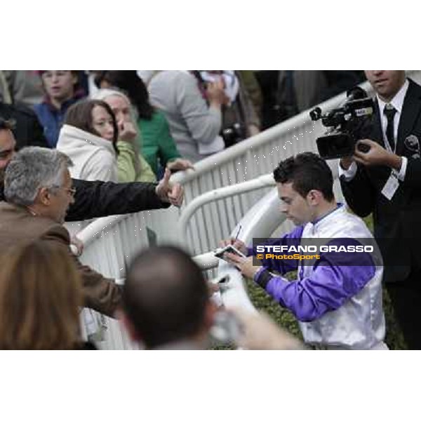 Paris - Longchamp racecourse Umberto Rispoli signs autographs after winning the Prix du Cadran Paris, 7th oct.2012 ph.Stefano Grasso