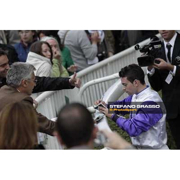 Paris - Longchamp racecourse Umberto Rispoli signs autographs after winning the Prix du Cadran Paris, 7th oct.2012 ph.Stefano Grasso