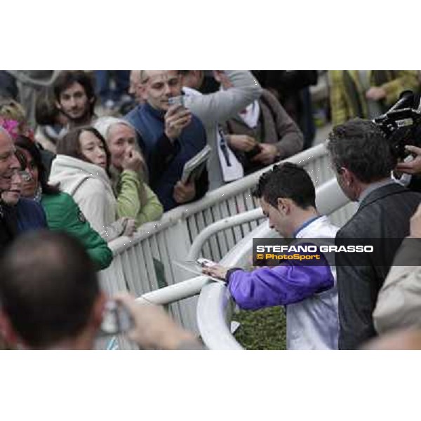 Paris - Longchamp racecourse Umberto Rispoli signs autographs after winning the Prix du Cadran Paris, 7th oct.2012 ph.Stefano Grasso