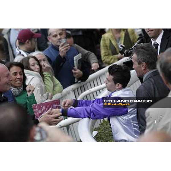 Paris - Longchamp racecourse Umberto Rispoli signs autographs after winning the Prix du Cadran Paris, 7th oct.2012 ph.Stefano Grasso