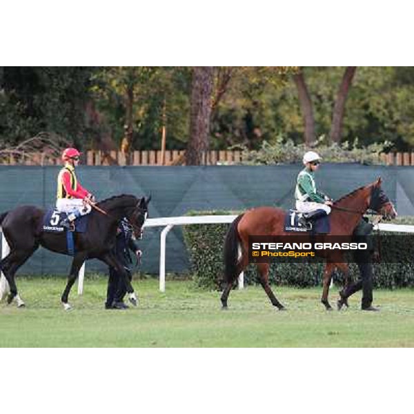 Mickael Barzalona on Wedding Fair and Olivier Peslier on Nova Hawk go to the start of the Premio Longines Lydia Tesio Roma - Capannelle racecourse,28th oct.2012 ph.Stefano Grasso