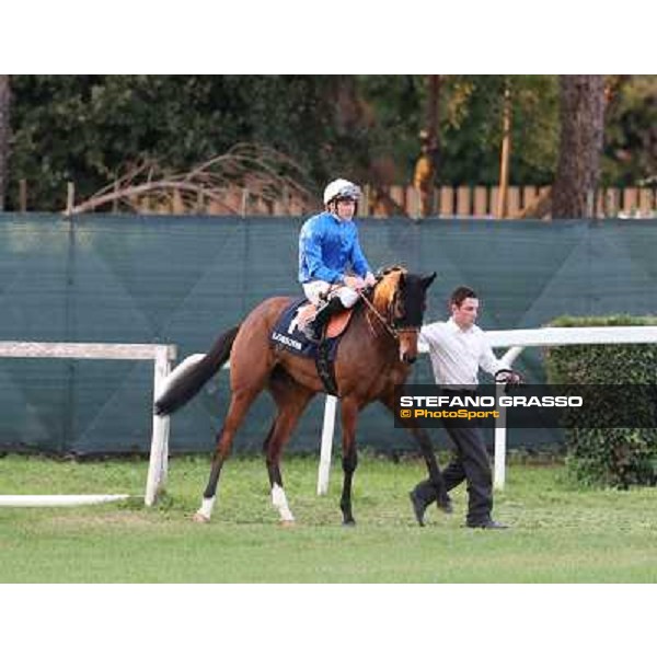 Thomas Huet on Aquamarine goes to the start of the Premio Longines Lydia Tesio Roma - Capannelle racecourse,28th oct.2012 ph.Stefano Grasso
