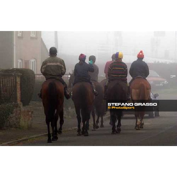 Dr. Philip Pritchard with his stable staff coming back home after morning works Purton, Gloucestershire 19th march 2005 Ph. Stefano Grasso