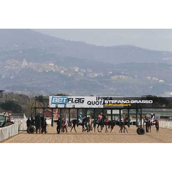 Premio Unire - The horses and jockeys enter the starting stalls before the start Rome - Capannelle racecourse,23rd dec.2012 ph.Stefano Grasso