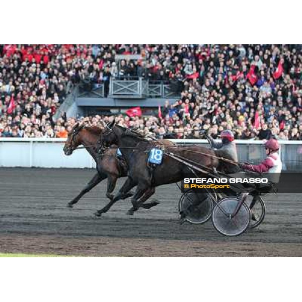 Jean Philippe Dubois and Royal Dream pass Franck Nivard and Ready Cash and go to win the Grand Prix d\'Amerique Paris - Vincennes racecourse,27th january 2013 ph.Stefano Grasso