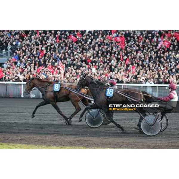 Jean Philippe Dubois and Royal Dream pass Franck Nivard and Ready Cash and go to win the Grand Prix d\'Amerique Paris - Vincennes racecourse,27th january 2013 ph.Stefano Grasso