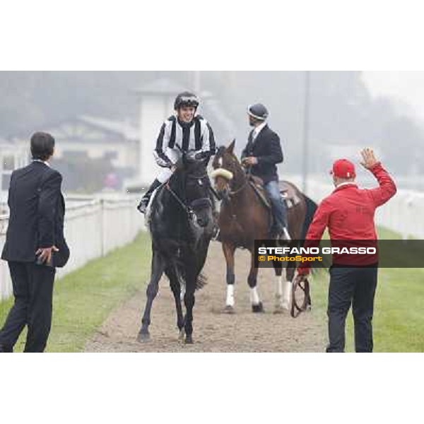 Cristian Demuro and Nabucco with Peter Franceschini and his groom after winning the Premio del Piazzale Milano,San Siro racecourse,20th oct.2013 ph.Stefano Grasso