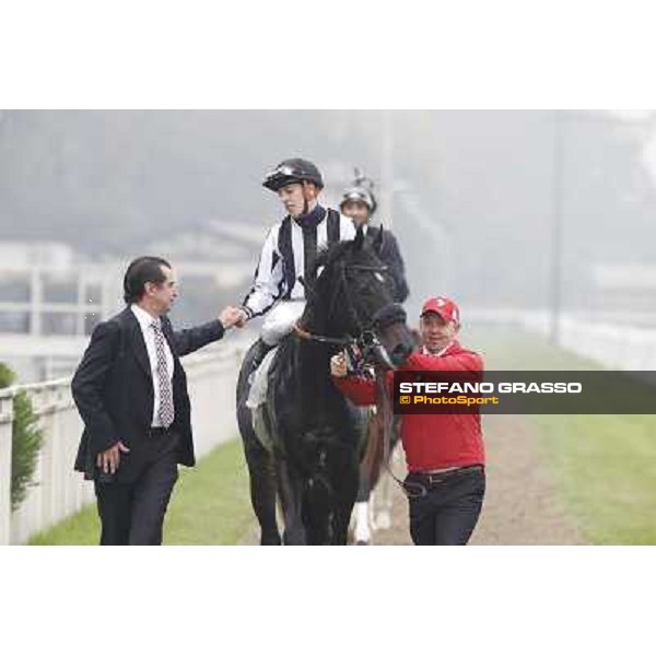 Cristian Demuro and Nabucco with Peter Franceschini and his groom after winning the Premio del Piazzale Milano,San Siro racecourse,20th oct.2013 ph.Stefano Grasso