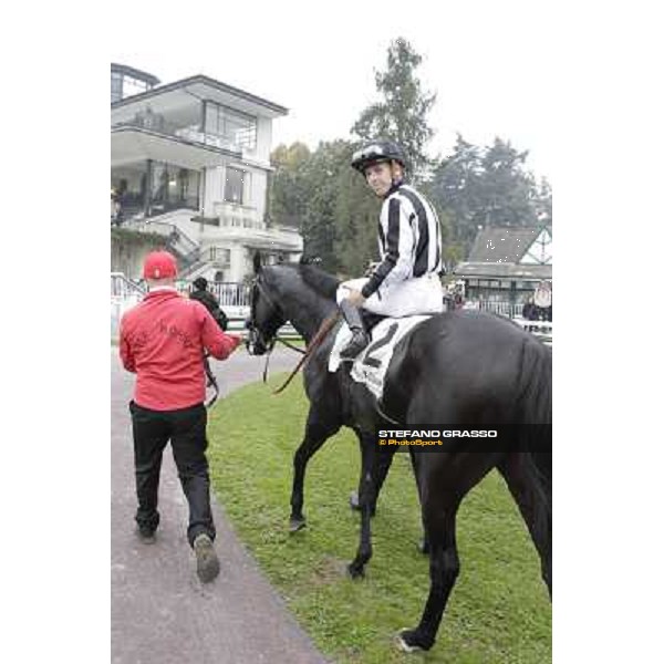 Cristian Demuro on Nabucco with Peter Franceschini and the groom after winning the Premio del Piazzale Milano,San Siro racecourse,20th oct.2013 ph.Stefano Grasso