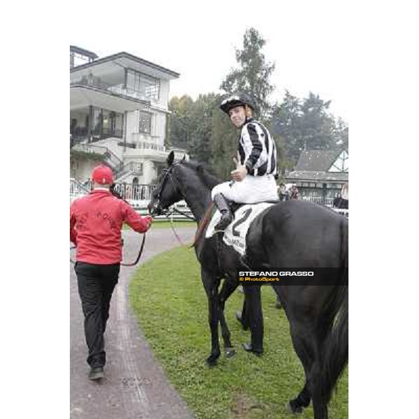 Cristian Demuro on Nabucco with Peter Franceschini and the groom after winning the Premio del Piazzale Milano,San Siro racecourse,20th oct.2013 ph.Stefano Grasso