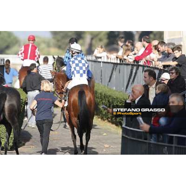 Jockeys and horses enter the track Roma,Capannelle racecourse,3rd nov.2013 ph.Stefano Grasso