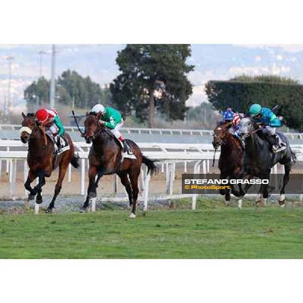 Antonio Fresu on Svatantra wins the Premio Federico Smith beating Carlo Fiocchi on Cleo Fan Rome - Capannelle racecourse,9th march 2014 ph.Domenico Savi/Grasso