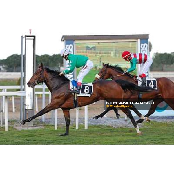 Antonio Fresu on Svatantra wins the Premio Federico Smith beating Carlo Fiocchi on Cleo Fan Rome - Capannelle racecourse,9th march 2014 ph.Domenico Savi/Grasso