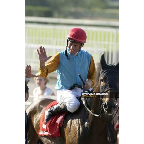 exulting Adrie De Vries on Gyreka enters in the winner enclosure after winning The Oaks d\'Italia San Siro, Milan 18th june 2005 ph. Stefano Grasso