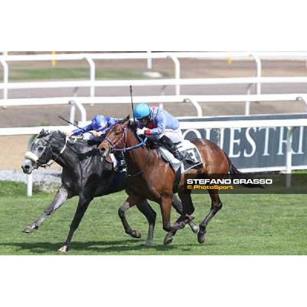 Cristian Demuro on Freedom Holder wins the Premio Daumier - Mem.Marco Rinaldi - 2nd is Salvatore Sulas on Hoovergetthekeys Roma - Capannelle racecourse,6th april 2014 ph.Stefano Grasso