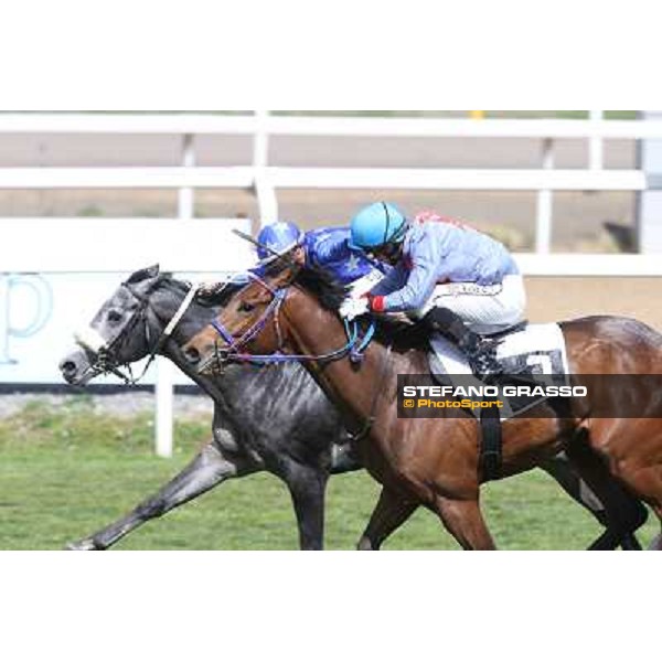 Cristian Demuro on Freedom Holder wins the Premio Daumier - Mem.Marco Rinaldi - 2nd is Salvatore Sulas on Hoovergetthekeys Roma - Capannelle racecourse,6th april 2014 ph.Stefano Grasso