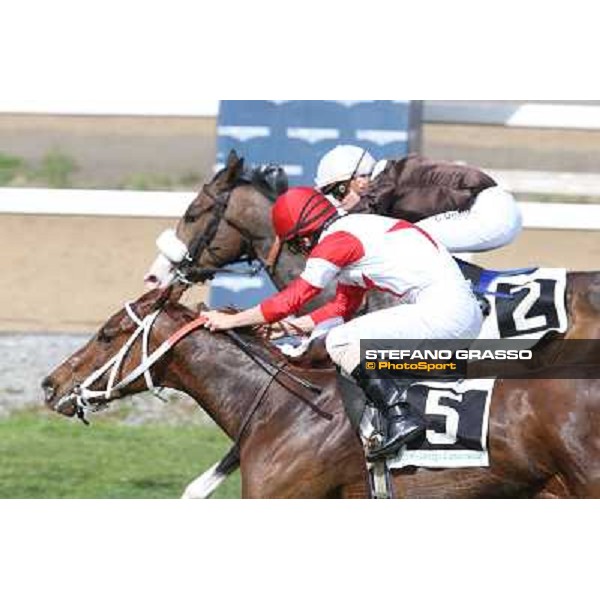 Cristian Demuro on Donna Prassede wins the Premio Torricola - 2nd is Gabriele Bietolini on Kitten\'s Lady Roma - Capannelle racecourse,6th april 2014 ph.Stefano Grasso