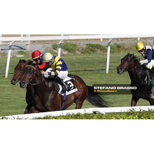 Dario Vargiu on Elettrotreno wins the Premio Le Moss beating Mirco Demuro on Le Vie Infinite Roma - Capannelle racecourse,11th april 2014 ph.Domenico Savi/Grasso