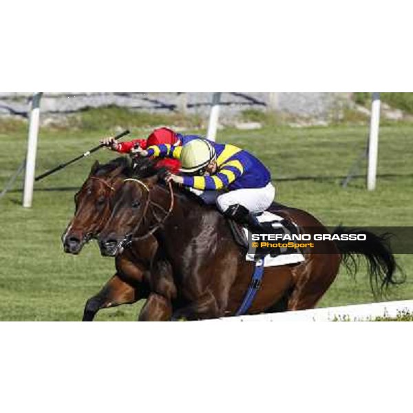 Dario Vargiu on Elettrotreno wins the Premio Le Moss beating Mirco Demuro on Le Vie Infinite Roma - Capannelle racecourse,11th april 2014 ph.Domenico Savi/Grasso