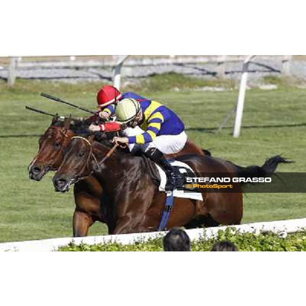 Dario Vargiu on Elettrotreno wins the Premio Le Moss beating Mirco Demuro on Le Vie Infinite Roma - Capannelle racecourse,11th april 2014 ph.Domenico Savi/Grasso