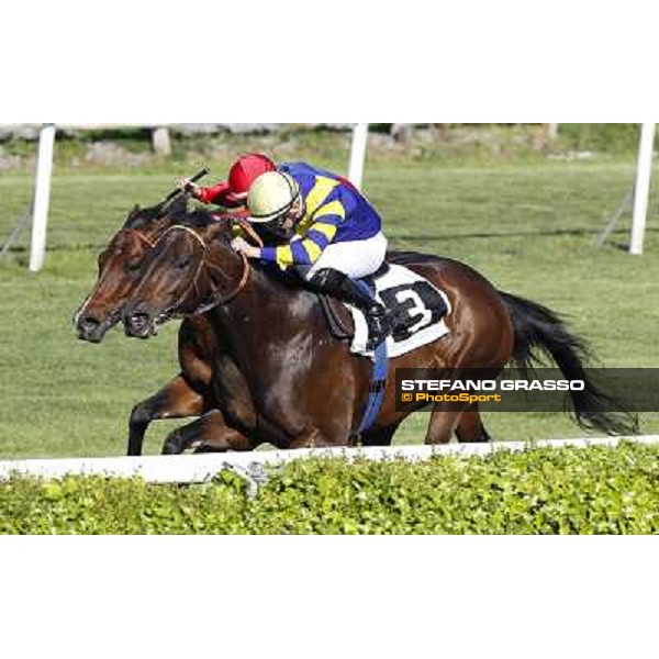Dario Vargiu on Elettrotreno wins the Premio Le Moss beating Mirco Demuro on Le Vie Infinite Roma - Capannelle racecourse,11th april 2014 ph.Domenico Savi/Grasso