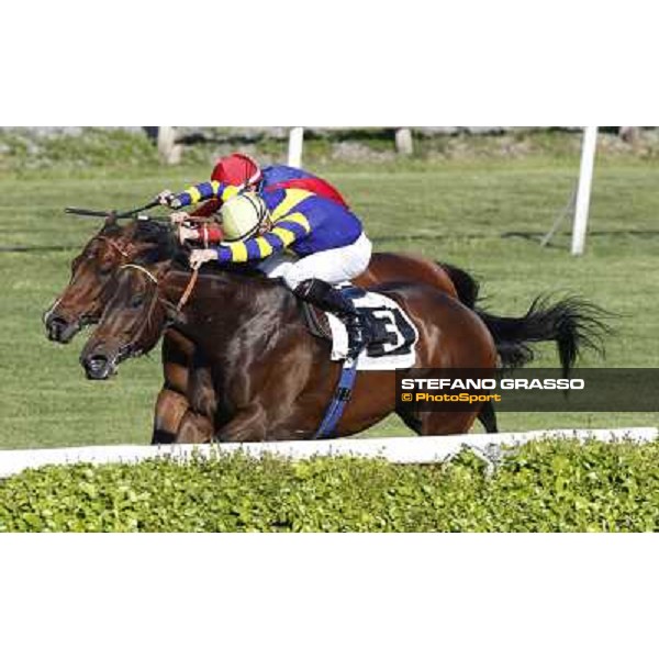 Dario Vargiu on Elettrotreno wins the Premio Le Moss beating Mirco Demuro on Le Vie Infinite Roma - Capannelle racecourse,11th april 2014 ph.Domenico Savi/Grasso