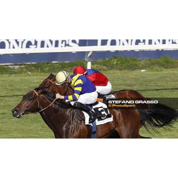 Dario Vargiu on Elettrotreno wins the Premio Le Moss beating Mirco Demuro on Le Vie Infinite Roma - Capannelle racecourse,11th april 2014 ph.Domenico Savi/Grasso