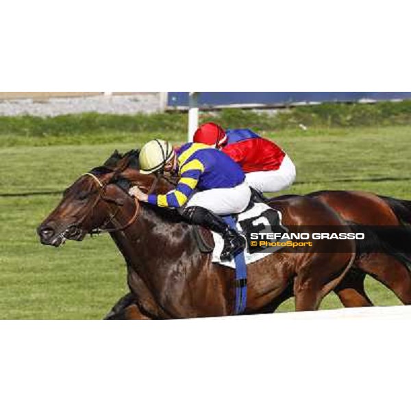 Dario Vargiu on Elettrotreno wins the Premio Le Moss beating Mirco Demuro on Le Vie Infinite Roma - Capannelle racecourse,11th april 2014 ph.Domenico Savi/Grasso
