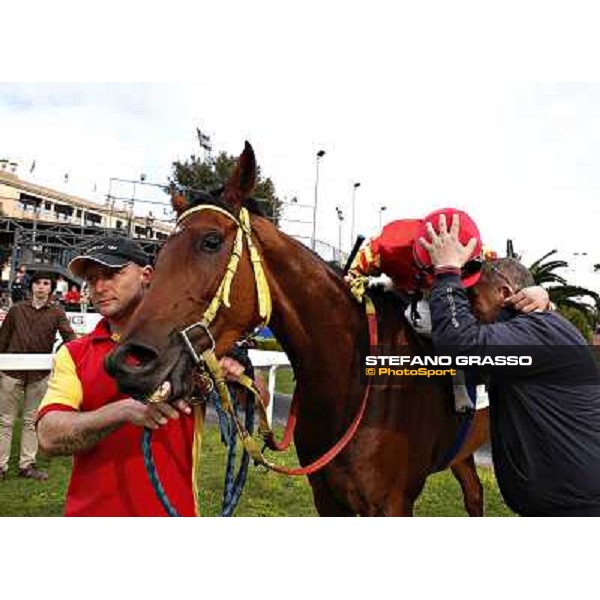 Luca Maniezzi on Clorofilla emabraces the owner after winning the Premio Carlo Chiesa Rome, Capannelle racecourse 13th april 2014 ph.Stefano Grasso