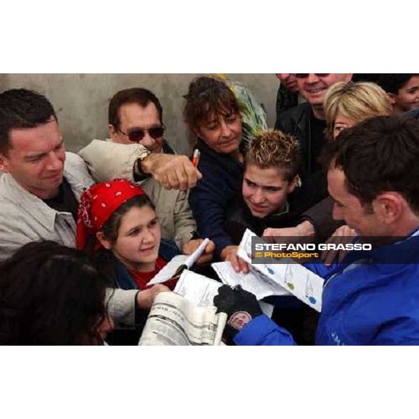 Jean-Michel Bazire at right signs autograpghs for his fans Criterium de Vitesse Cagnes sur Mer march 14 2004 ph.Stefano Grasso