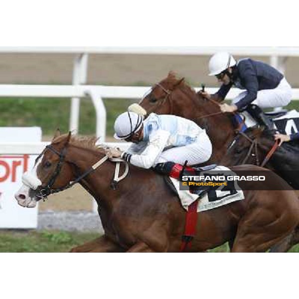 Dario Vargiu on Misterious Boy goes to win the Premio Guido Berardelli.Panther Cat is second Roma.Capannelle racecourse 26th october 2014 ph.Stefano Grasso