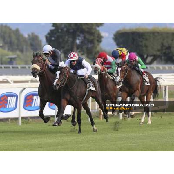 Olivier Peslier on Cape Magic wins the Premio Conte Felice Scheibler. Dario Vargiu on Uniram is second Roma.Capannelle racecourse 26th october 2014 ph.Domenico Savi/Grasso