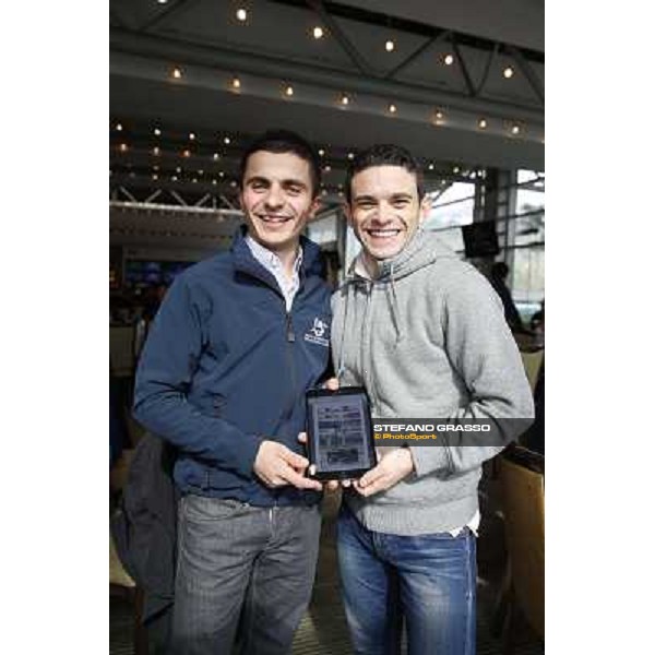 Andrea Atzeni and Umberto Rispoli with the I-PAd edition of Trotto \' Turf Hong Kong - Sha Tin racecourse,12/12/2014 ph.Stefano Grasso