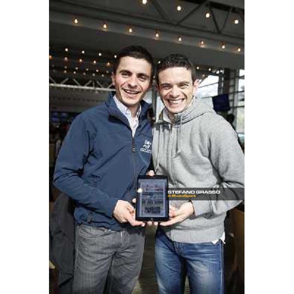 Andrea Atzeni and Umberto Rispoli with the I-PAd edition of Trotto \' Turf Hong Kong - Sha Tin racecourse,12/12/2014 ph.Stefano Grasso