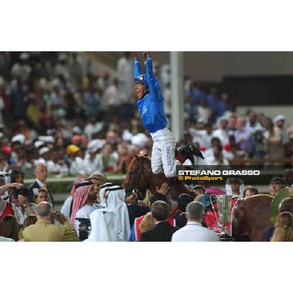  Frankie Dettori jumps from Moon Ballad, after winning the Dubai World Cup 2003 Nad El Sheba race track march 2003 ph.Stefano Grasso