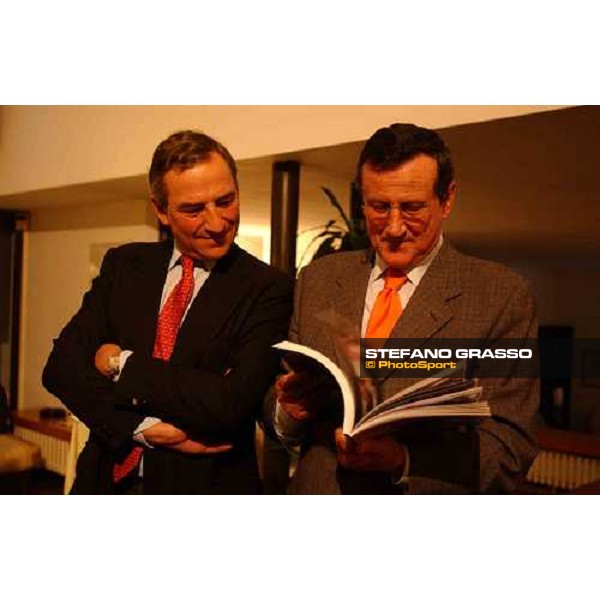 Mr. Luca Cumani and Mr. Luciano Salice looks the first copy of the book \'Falbrav- an italian story\' Carimate golf Club 29th april 2004 ph. Stefano Grasso