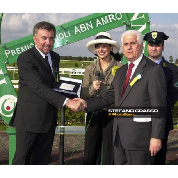 Stefano Grasso receives a plaque from dott. Enzo Mei, President of Capannelle race track, celebrating Falbrav\'s triumphs and his photographic exibition. Rome Capannelle 1st may 2004 ph. Corrado Garofalo 