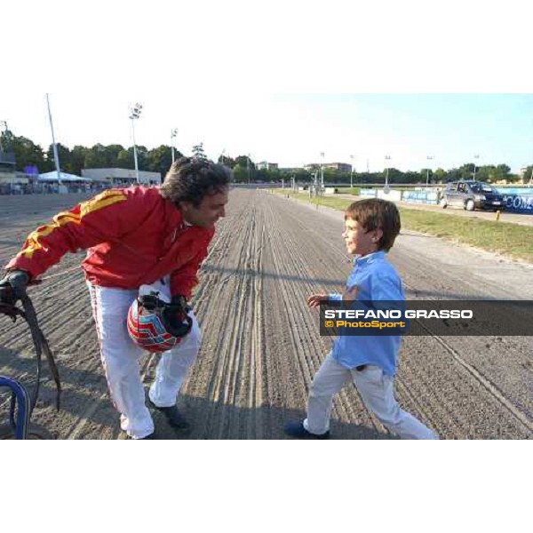 Pippo Gubellini receives the congratulations from his son Edoardo, after winning the Gran Premio Continentale with Daguet Rapide Bologna, 19th september 2004 ph. Stefano Grasso