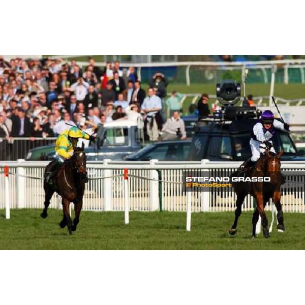Barry Geraghty and Kicking King lead on Take The Stand at last 50 meters to the line of The Totesport Cheltenham Gold Cup Steeple Chase Cheltenham - 4th day - 18th march 2005 ph. Stefano Grasso